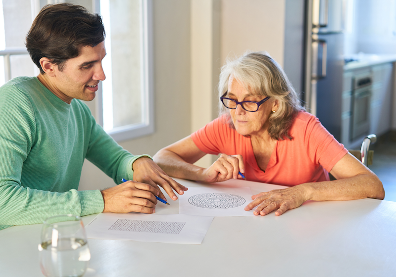 Man and woman doing puzzles